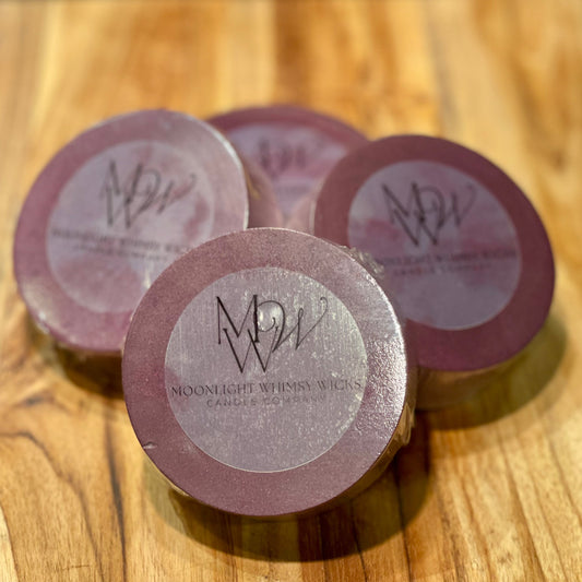 Handcrafted round goat's milk soap bar on an elegant wooden cutting board, showcasing its premium quality and organic ingredients for a luxurious skincare experience.