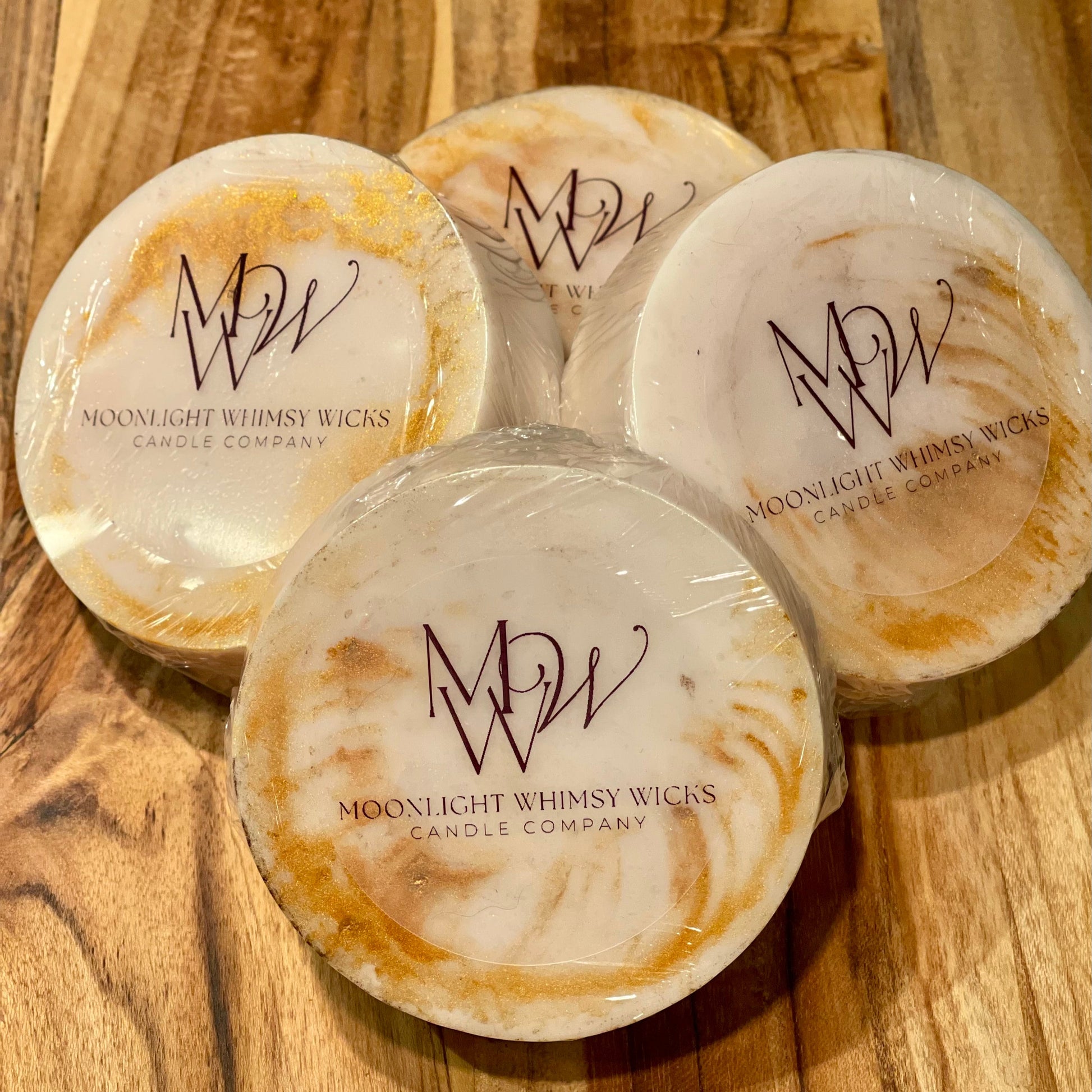 Handcrafted round goat's milk soap bar on an elegant wooden cutting board, showcasing its premium quality and organic ingredients for a luxurious skincare experience.