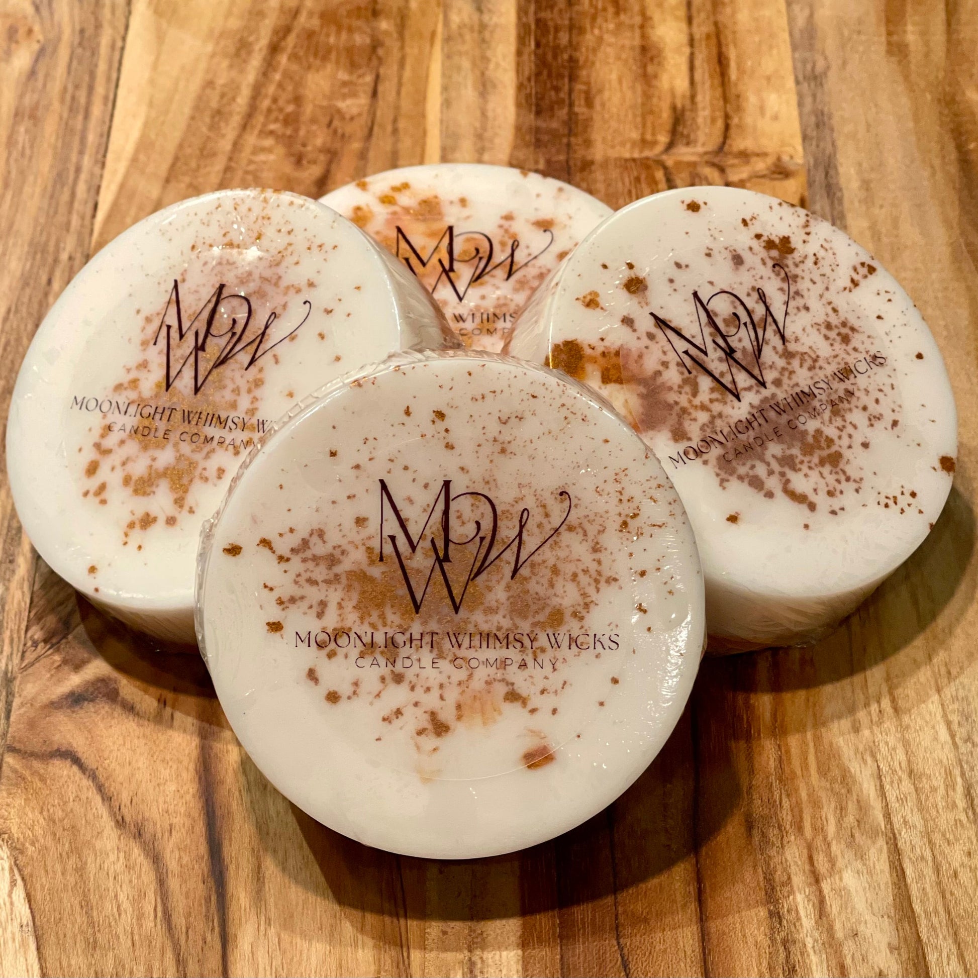 Handcrafted round goat's milk soap bar on an elegant wooden cutting board, showcasing its premium quality and organic ingredients for a luxurious skincare experience.