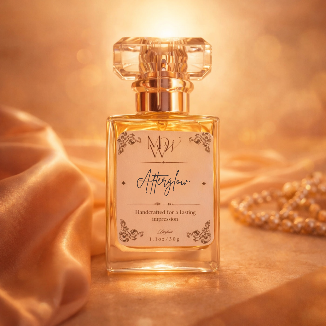 Perfume bottle labeled 'Afterglow' on a soft fabric background