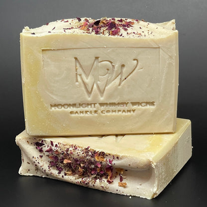 Bar of soap with visible brand logo on a dark background