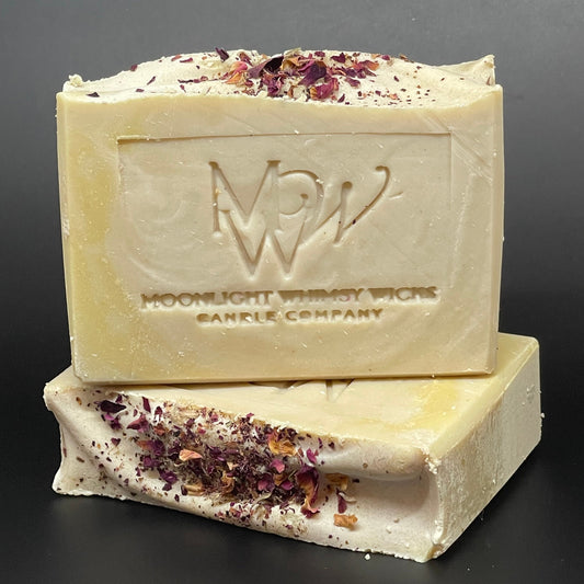 Bar of soap with visible brand logo on a dark background