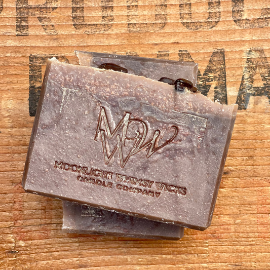 Handmade Coffee soap bar by Moonlight Whimsy Wicks, featuring warm earthy tones with the MWW logo stamped on top, set on a rustic wooden background.