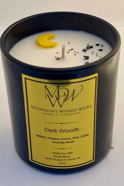 An  8 oz. Moonlight Whimsy Wicks Candle in the fragrance Dark Woods