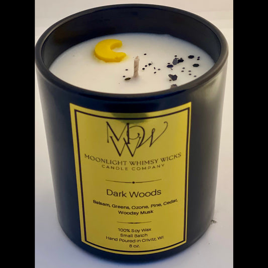 An  8 oz. Moonlight Whimsy Wicks Candle in the fragrance Dark Woods