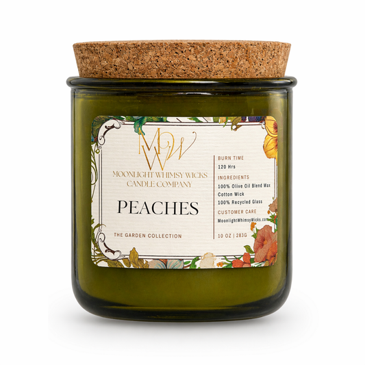 Peaches Candle from Moonlight Whimsy Wicks’ Garden Collection, styled in a green recycled glass jar with a cork lid and floral label.