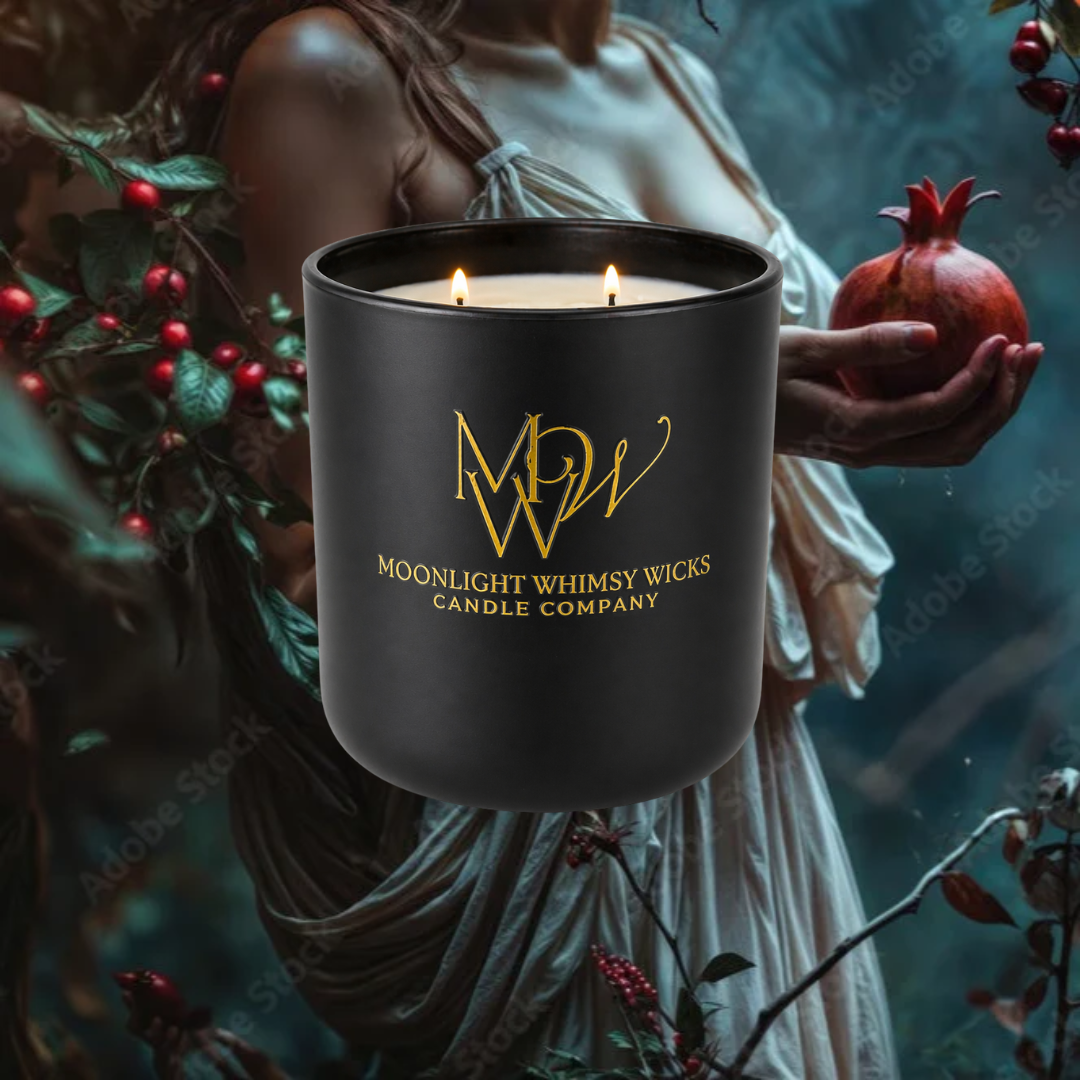 Black soy candle with 'Moonlight Whimsy Wicks' logo held by a person in a mystical outdoor garden setting.