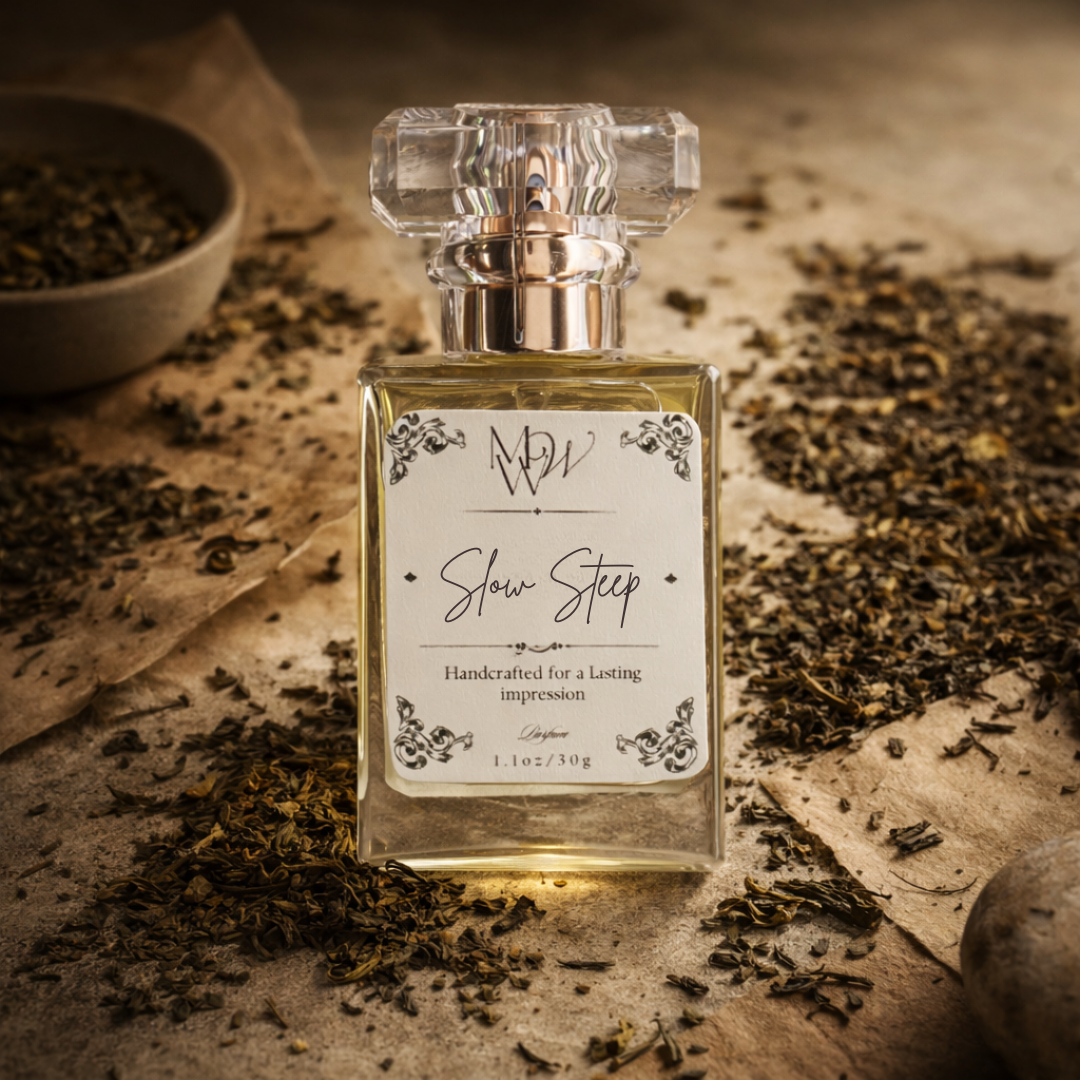 Perfume bottle labeled 'Slow Step' surrounded by dried leaves on a textured surface