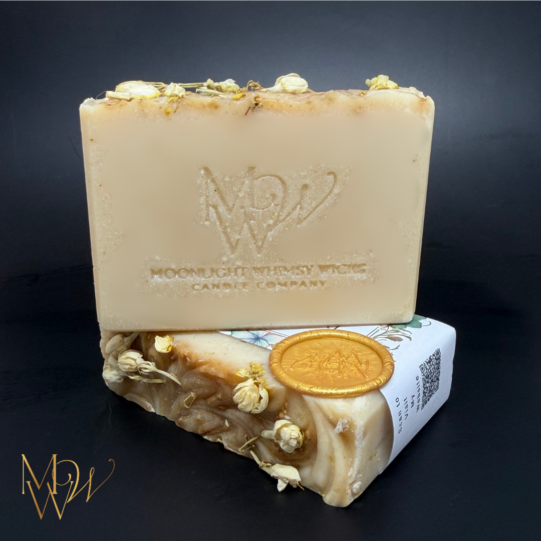 Creamy white soap with Jasmine buds on top and stamped with MWW for Moonlight Whimsy Wicks.