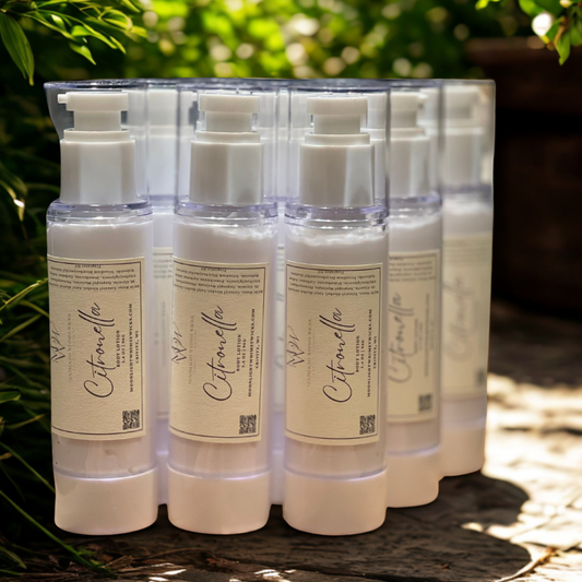 Upclose image of Citronella bottles filled with lotion in a garden on a gray brick 