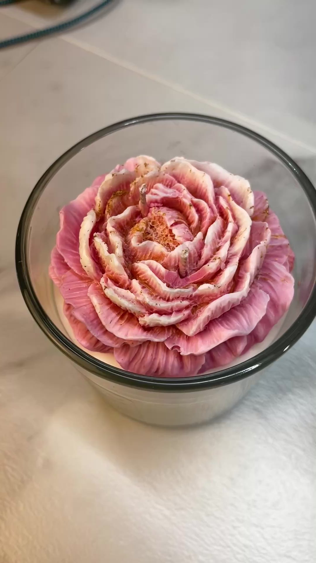 Pink peony atop a creamy white Soy Wax Candle